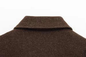 Detailed view of the dark brown lapel collar and premium wool blend fabric stitching