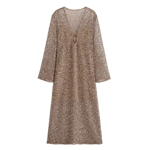 Detailed view of khaki brown sequined fabric on a deep V-neck long sleeve dress