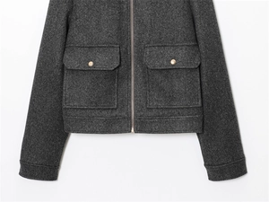 Close-up of soft dark grey jacket featuring wool blend texture and gold metal buttons