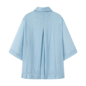 Light blue short-sleeved shirt with texture and back box pleat design on white background