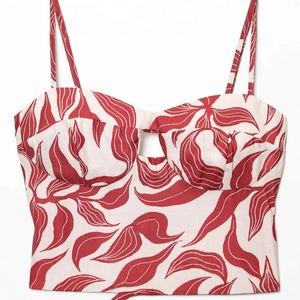 Women's off-white floral bustier top with red leaf print and thin shoulder straps