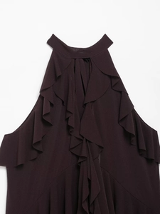 Detail of elegant plum halter top featuring layered ruffles and textured chiffon fabric