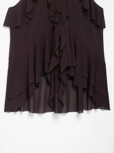 Close-up of deep wine red layered ruffles on a halter neck top with chiffon texture