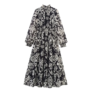 Detail of high-neck printed chiffon maxi dress with elastic waist and tiered skirt