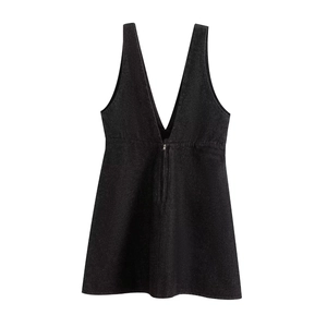 Detail view of black denim sleeveless dress with deep V-neck and metal front zipper