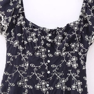 Dark blue midi dress with white floral embroidery, square neckline and button details