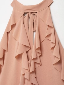 Detail of pink halter top with ruffled layers and delicate back-neck tie closure