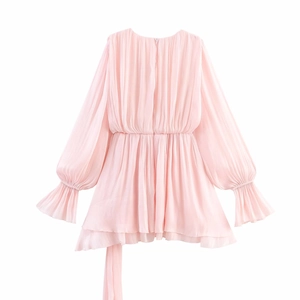 Pink pleated long sleeve dress with double ruffled layers and lantern cuffs on white background