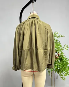 Detailed back view of a green long-sleeve bomber jacket featuring pleated draped texture