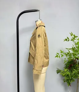 Detail of khaki twill cotton jacket showing shoulder epaulets and large side pockets