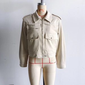 Detail of faux suede utility jacket featuring large chest pockets and zipper detail