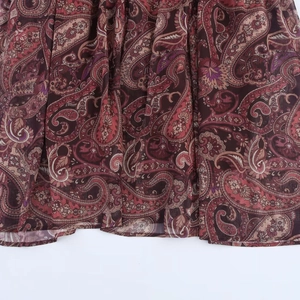 Bohemian paisley print v-neck dress with ruffles and belt in burgundy chiffon fabric