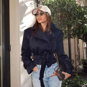 Classic navy blue double-breasted short trench coat with waist belt for a chic look