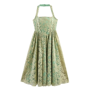 Close-up detail of light green halter lace dress featuring floral jacquard fabric texture
