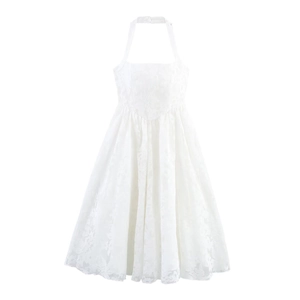 Detailed view of white halter neck dress featuring intricate floral lace texture and A-line cut