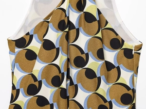Detail shot of vintage geometric print fabric with side invisible zipper on dress