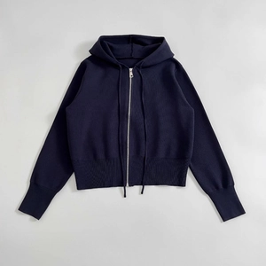 Navy blue knitted zip-up hoodie featuring flat knit fabric and ribbed cuffs and hem