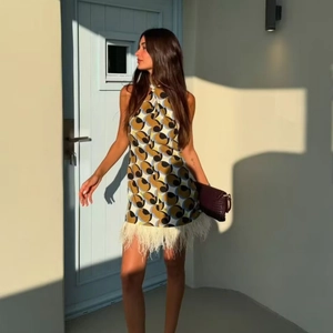 Chic halter neck geometric print mini dress with cream feather trim for autumn fashion