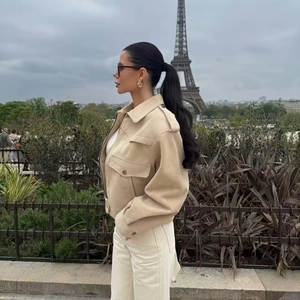 Chic beige suede jacket for women featuring a lapel collar and shoulder epaulettes