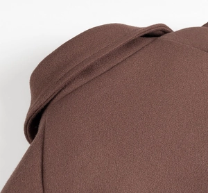 Detail of the high-quality brown wool blazer collar showing professional tailoring and seams