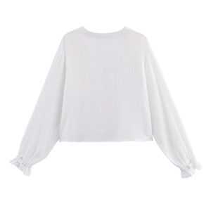 White long-sleeved shirt with vertical texture and ruffled cuffs, flat-lay back view