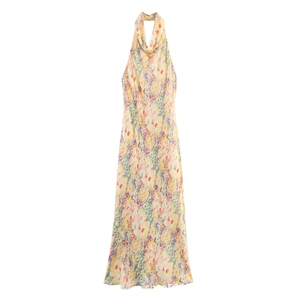 Detailed view of floral halter maxi dress with pink and yellow flowers on beige fabric