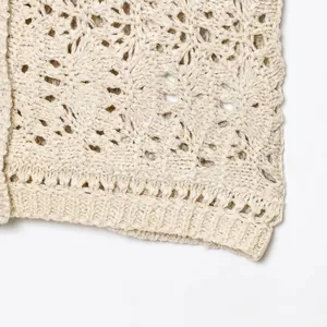 Women's beige hollow crochet knit cardigan with floral patterns and ribbed hem detail