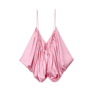 Detail of pink satin camisole top featuring delicate pleats and ultra-thin straps