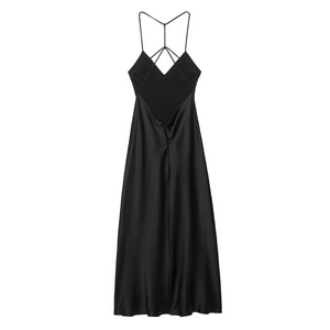 Detail of elegant black satin midi dress featuring crisscross back straps and smooth texture