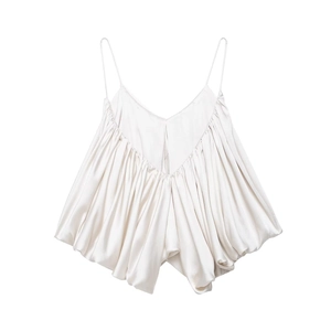 Detailed view of pearl white pleated satin camisole with thin spaghetti straps
