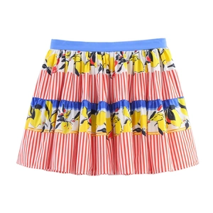 Detail showing the lemon floral print and red striped tiers of this summer skirt