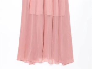 Detailed view of the layered pink midi dress hem crafted in lightweight chiffon fabric