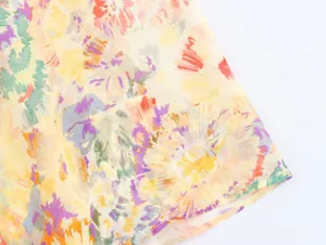 Detailed macro view showing the vibrant floral print and woven fabric texture