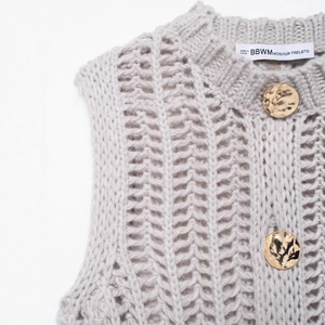 Grey chunky knit vest with hollow mesh texture and large hammered gold buttons
