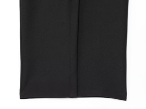 Detailed close-up of smooth black fabric with neat stitching and premium knit texture