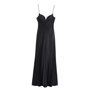 Detail view of black silk satin maxi dress featuring thin straps and pleated v-neckline