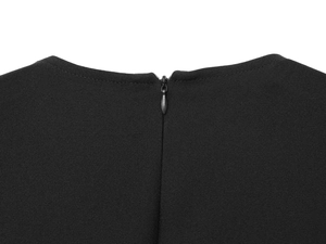 Close-up of invisible back zipper and textured crepe fabric on black midi dress