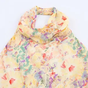 Floral print halter neck chiffon dress featuring a colorful artistic flower pattern