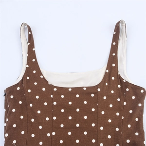 Detail of square neckline and thin straps on brown polka dot midi dress with lining