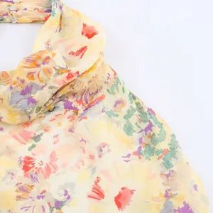 Floral chiffon halter neck blouse with vibrant abstract flower prints and button details