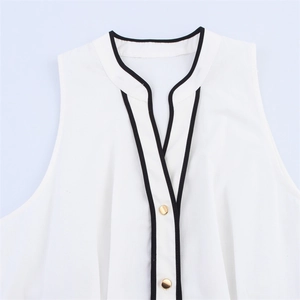 White sleeveless midi dress with contrast black trim and gold buttons on V-neck collar
