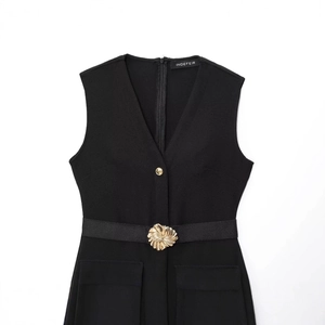 Elegant black V-neck sleeveless midi dress with a decorative gold buckle and matching belt