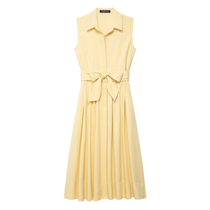 Close-up of pale yellow sleeveless shirt dress with belted waist and buttoned collar