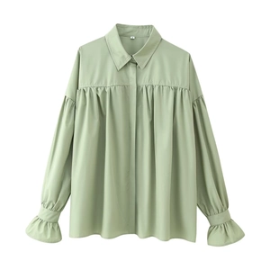 Elegant light green long sleeve shirt with pleated details and stylish bell sleeves