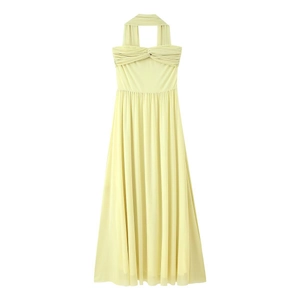 Elegant light yellow halter neck pleated maxi dress with twist front detail and open back