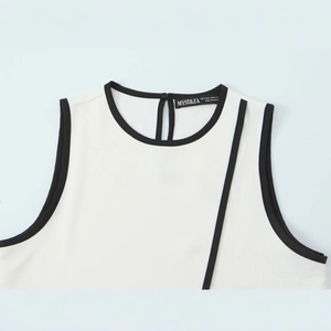 White crepe sleeveless top with black contrast trim and teardrop button back closure