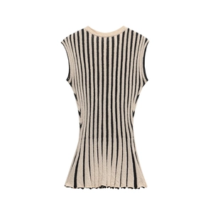 Detail shot of sleeveless knitted top with vertical black and white textured stripes