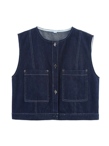 Detailed macro view of dark blue denim vest with white contrast stitching and snap buttons