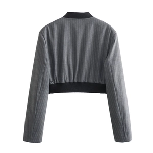 Close-up of gray pinstripe cropped jacket with black ribbed collar and seam details