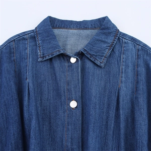 Blue denim dress with belt and silver buttons featuring orange contrast stitching details